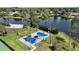 Scenic basketball court near a serene lake and lush greenery for outdoor recreation at 926 Wood Briar Loop, Sanford, FL 32771