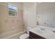 Bright bathroom featuring a tub, toilet, vanity with sink, and a large mirror at 926 Wood Briar Loop, Sanford, FL 32771