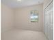 A bright bedroom with a ceiling light, a large window, and a spacious closet at 926 Wood Briar Loop, Sanford, FL 32771