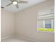 Bright bedroom with a ceiling fan, window with blinds, and neutral paint at 926 Wood Briar Loop, Sanford, FL 32771