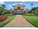 Stately home with elegant brick and stone facade, manicured landscaping, and grand entrance at 926 Wood Briar Loop, Sanford, FL 32771