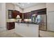 Spacious kitchen boasts stainless steel appliances, dark cabinetry, granite counters, and a center island at 926 Wood Briar Loop, Sanford, FL 32771