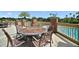 Outdoor pool deck with beautiful views, features tables with chairs for sitting and relaxing at 926 Wood Briar Loop, Sanford, FL 32771