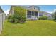 Enjoy the lush landscaping and screened-in porch of this backyard oasis at 1539 Osprey View Dr, Apopka, FL 32703