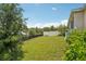 Spacious backyard with manicured lawn and privacy fence, perfect for outdoor activities at 1539 Osprey View Dr, Apopka, FL 32703