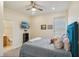 A bedroom with cool neutral paint, a ceiling fan, and a flat screen television on the wall at 1539 Osprey View Dr, Apopka, FL 32703