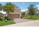 Charming two-story home featuring a three-car garage, well-maintained lawn, and inviting curb appeal at 1539 Osprey View Dr, Apopka, FL 32703