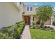 Inviting front entrance with a covered porch, brick pathway, and well-maintained landscaping at 1539 Osprey View Dr, Apopka, FL 32703