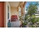 Cozy front porch with a decorative bench, plants, and a welcoming outdoor ambiance at 1539 Osprey View Dr, Apopka, FL 32703