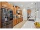 Modern kitchen features stainless steel appliances, granite countertops, gas range, and ample cabinet space for storage at 1539 Osprey View Dr, Apopka, FL 32703