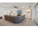 Spacious living room with a large sectional sofa and an entertainment center at 1539 Osprey View Dr, Apopka, FL 32703
