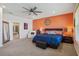 Spacious main bedroom featuring a decorative accent wall, ceiling fan, and ample natural light at 1539 Osprey View Dr, Apopka, FL 32703