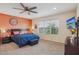 Comfortable main bedroom with a stylish accent wall, ceiling fan, and a large window with serene views at 1539 Osprey View Dr, Apopka, FL 32703