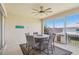 Enjoy outdoor dining on this covered patio with ceiling fan and neighborhood views at 1539 Osprey View Dr, Apopka, FL 32703