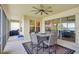 Relax on this covered patio with grill and ceiling fan, perfect for entertaining at 1539 Osprey View Dr, Apopka, FL 32703