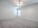 Light bedroom with carpet flooring, ceiling fan and a window at 1016 Eagles Lndg, Leesburg, FL 34748