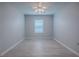Bedroom features light-colored wood floors, natural light, and a ceiling fan at 1016 Eagles Lndg, Leesburg, FL 34748