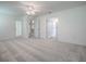 Large bedroom shows multiple closets, ceiling fan, and doorways at 1016 Eagles Lndg, Leesburg, FL 34748