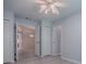 Bedroom with light-colored wood floors and view to living spaces at 1016 Eagles Lndg, Leesburg, FL 34748