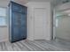 Spacious bedroom featuring neutral flooring, blue built-in cabinet, and white trim at 1016 Eagles Lndg, Leesburg, FL 34748