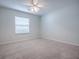 Bright bedroom with carpet flooring, ceiling fan and a window at 1016 Eagles Lndg, Leesburg, FL 34748