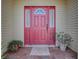 Inviting front door with sidelights, potted plants, and a brick walkway creating a warm entrance at 1016 Eagles Lndg, Leesburg, FL 34748