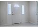 Bright and airy entryway featuring a white front door with sidelights and tiled flooring at 1016 Eagles Lndg, Leesburg, FL 34748