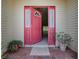 Inviting front door with sidelights and potted plants, offering a glimpse into the home's interior at 1016 Eagles Lndg, Leesburg, FL 34748