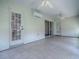Enclosed patio featuring tile flooring, ceiling fans, and glass doors for natural light and outdoor access at 1016 Eagles Lndg, Leesburg, FL 34748