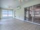 Spacious sunroom with tile flooring, ceiling fans, and sliding glass doors leading to the outdoors at 1016 Eagles Lndg, Leesburg, FL 34748
