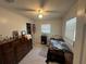 Cozy bedroom with natural light, offering a peaceful retreat after a long day at 102 Harold St, Leesburg, FL 34748