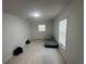 Clean bedroom with natural light, and tile flooring at 102 Harold St, Leesburg, FL 34748