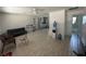 Spacious living room with lots of natural light and wood-style flooring is awaiting your personal design touches at 102 Harold St, Leesburg, FL 34748