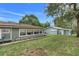 Spacious backyard showcasing the home's exterior, with potential for outdoor activities and relaxation at 10301 Us Highway 27 # 187, Clermont, FL 34711