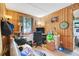 Cozy wood paneled bedroom with a window and a work desk at 10301 Us Highway 27 # 187, Clermont, FL 34711
