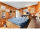 Wood paneled bedroom with blue bedspread and natural light at 10301 Us Highway 27 # 187, Clermont, FL 34711