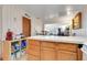 Kitchen counter and cabinets with pass through to dining area at 10301 Us Highway 27 # 187, Clermont, FL 34711