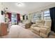 Inviting living room with plush sofas, neutral carpet, and ample natural light, offering a cozy atmosphere at 10301 Us Highway 27 # 187, Clermont, FL 34711