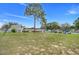 Community playground with swings and slide amidst a backdrop of well-maintained homes offers a fun and safe recreation space at 10301 Us Highway 27 # 187, Clermont, FL 34711