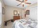 Calm bedroom featuring a ceiling fan, large closet, and cozy quilt on the bed at 10986 Se 171St Street Rd, Summerfield, FL 34491