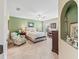 Comfortable bedroom with carpet, ceiling fan, and a window providing natural light at 10986 Se 171St Street Rd, Summerfield, FL 34491