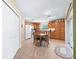 Bright eat-in kitchen features tile floors, appliances, oak cabinetry, and sliding door access to the lanai at 10986 Se 171St Street Rd, Summerfield, FL 34491