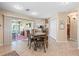 Bright eat-in kitchen features tile floors, appliances, oak cabinetry, and sliding door access to the lanai at 10986 Se 171St Street Rd, Summerfield, FL 34491