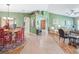 Open floor plan with spacious living and dining areas, tiled floors, and archways at 10986 Se 171St Street Rd, Summerfield, FL 34491