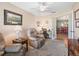 Bright sitting room with leather chairs, neutral walls and area rug at 10986 Se 171St Street Rd, Summerfield, FL 34491