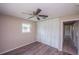 Bedroom with a closet, window, and ceiling fan at 110 River Beach Dr, Ormond Beach, FL 32176