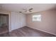 Bedroom features a closet, ceiling fan, wood floors, and a window for natural light at 110 River Beach Dr, Ormond Beach, FL 32176