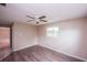 Bright bedroom with a view, ceiling fan, and modern flooring at 110 River Beach Dr, Ormond Beach, FL 32176