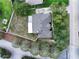 Aerial view of a home with backyard patio and lush landscaping at 11036 Bronson Rd, Clermont, FL 34711