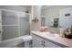 Bathroom featuring tile flooring, vanity with a sink, and a shower and tub combo at 11036 Bronson Rd, Clermont, FL 34711